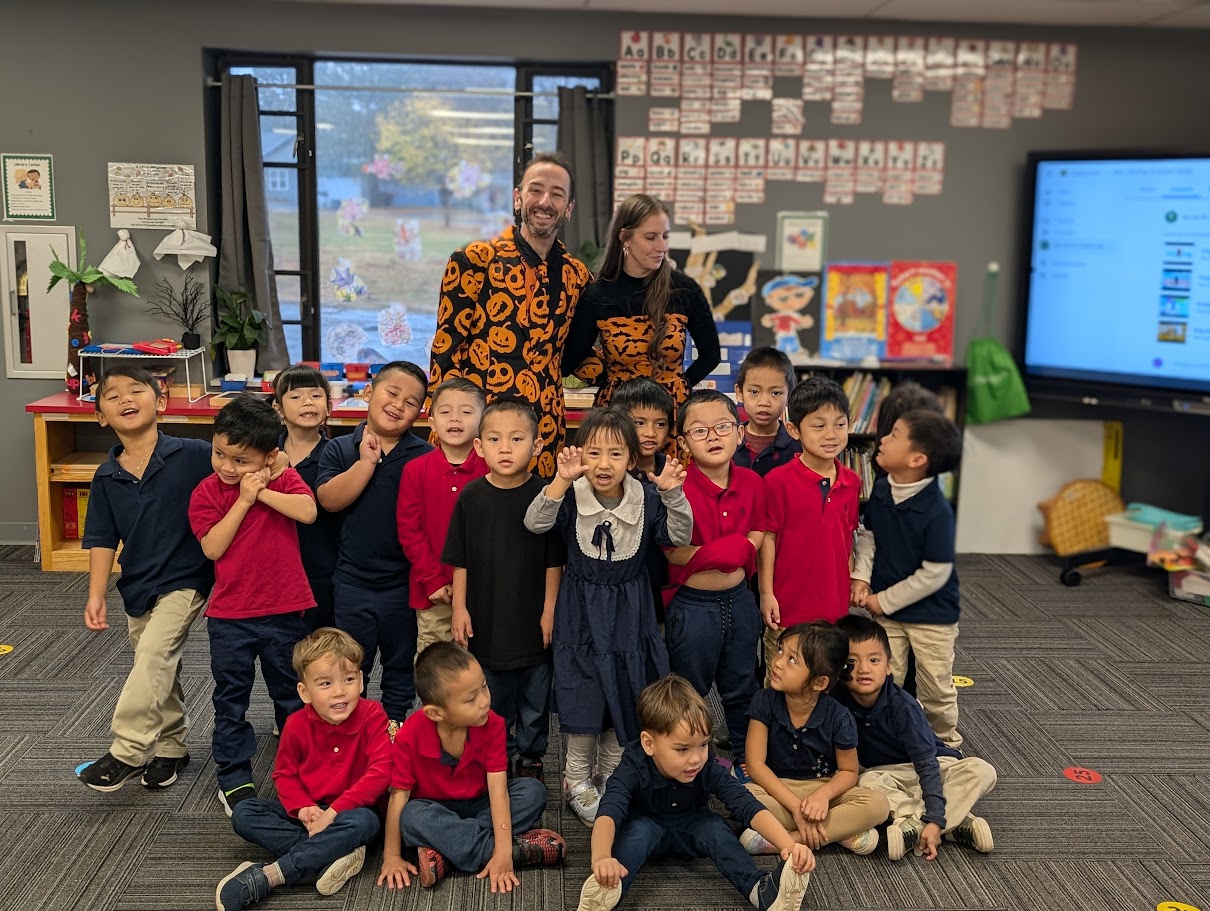 Students and staff using technology in a classroom